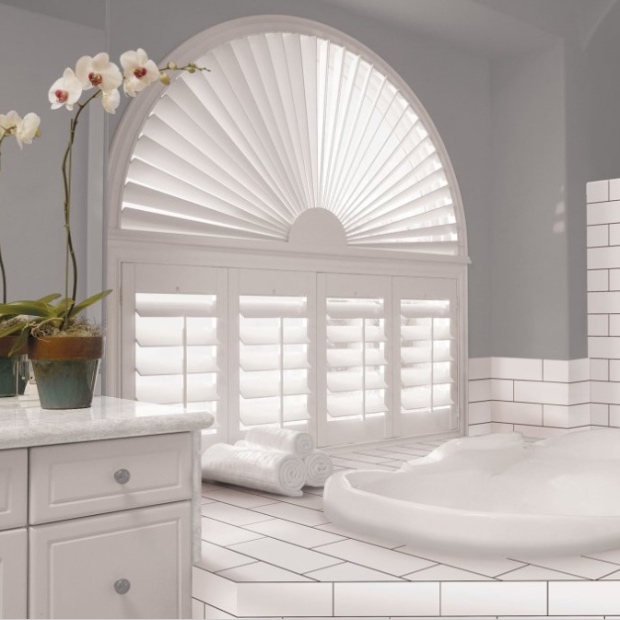 Arched shutters in a  bathroom