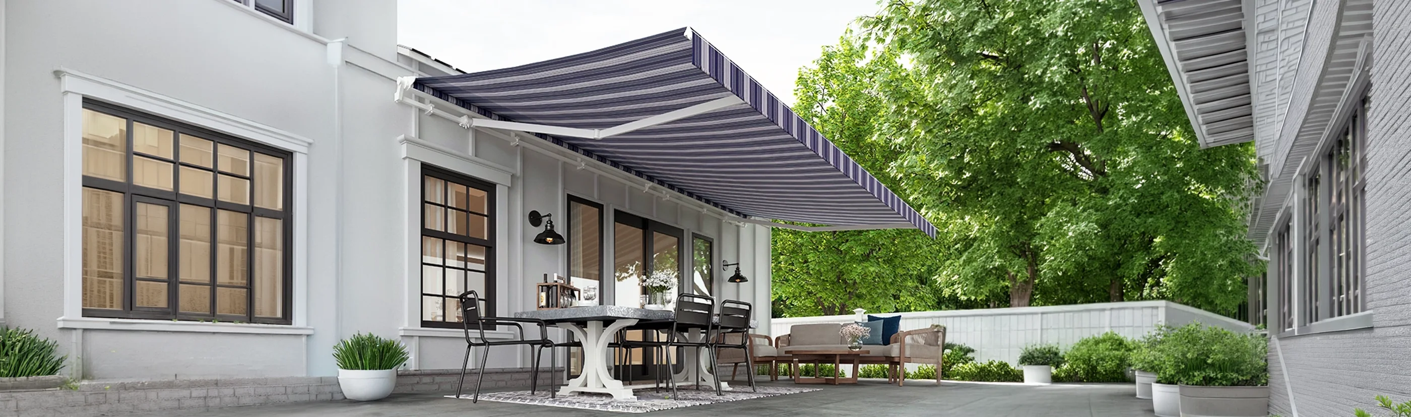blue and white striped awning over a large patio in between two buildings on a sunny day