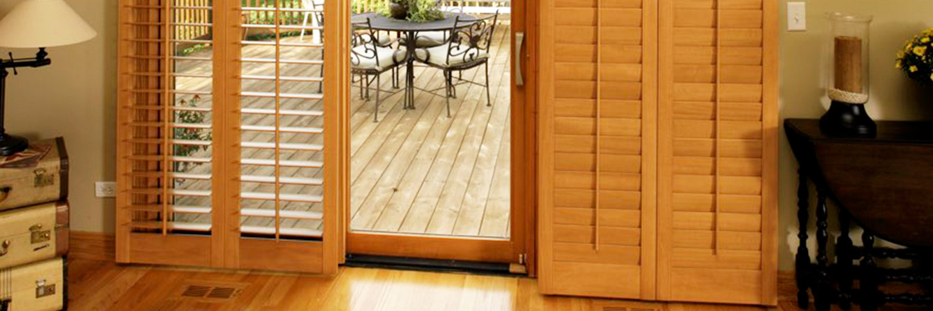 Light oak shutters on patio doors