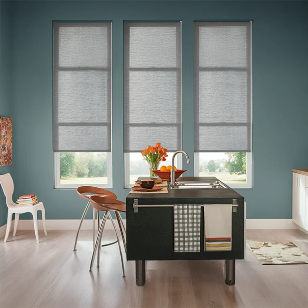 Gray roller shades in a urban like kitchen area