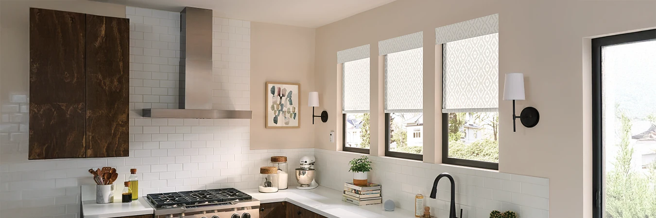 white printed pattern roller shades above a kitchen sink area