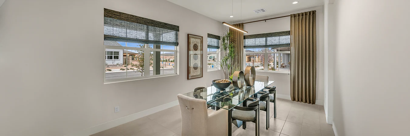 sage green woven shades in a large beige dining room