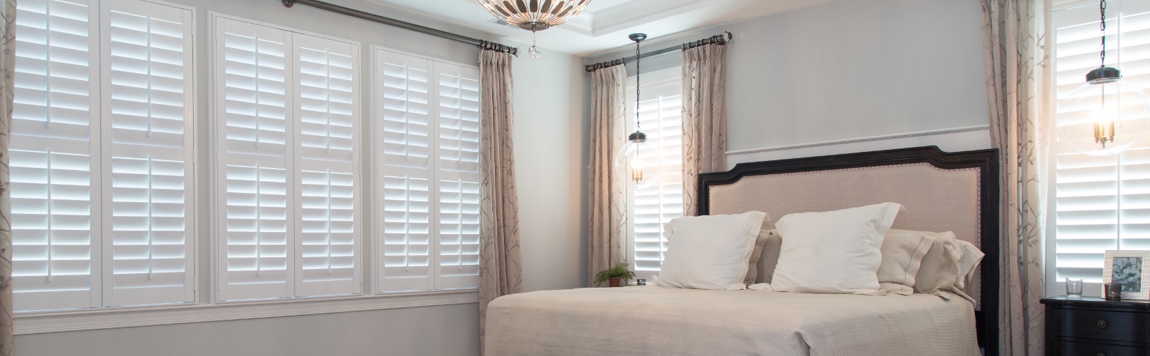 Plantation shutters in a bedroom