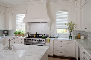 White kitchen with green accents and shades