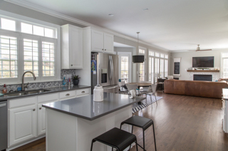 White kitchen with plantation shutters