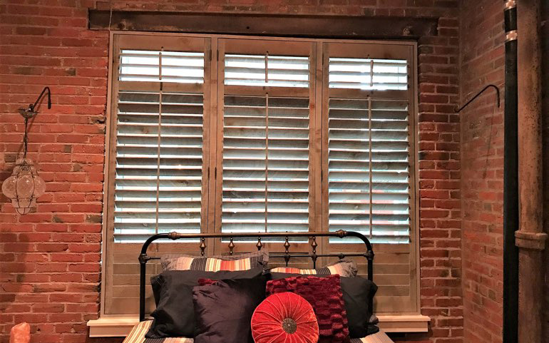 Reclaimed wood shutters in a window