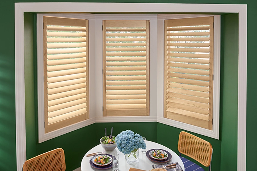 faux wood shutters on bay windows