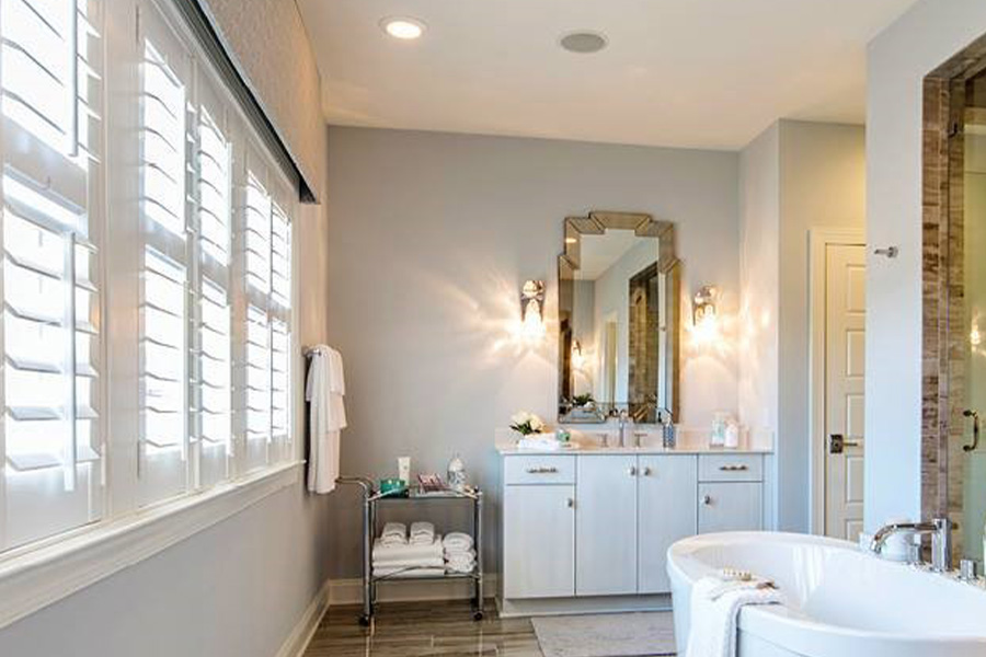 White Polywood shutter window inside a bathroom.