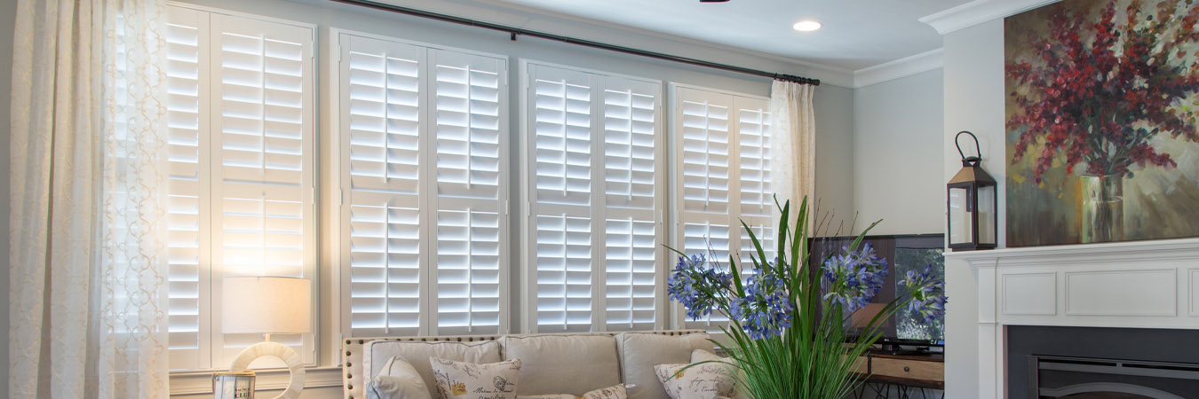 White polywood shutters in a living room.
