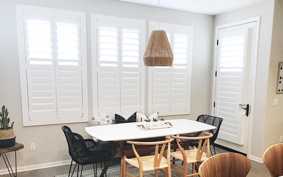 White split tilt shutters in a kitchen.