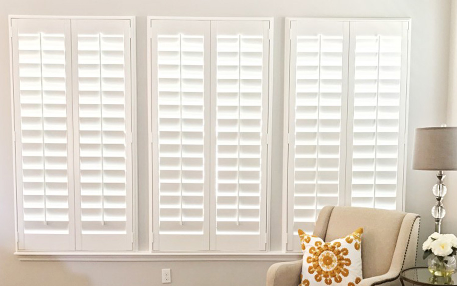 White polywood shutters in a living room.