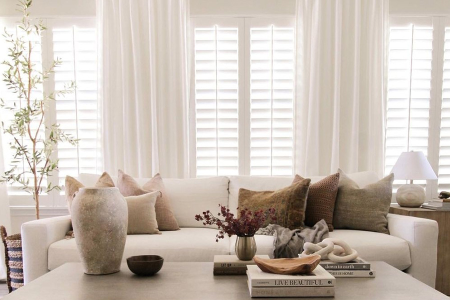 White polywood shutters in a large living room