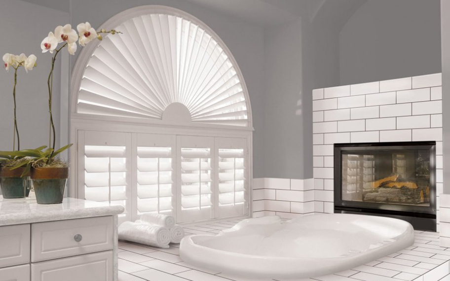 White sunburst arch in a fancy bathroom.