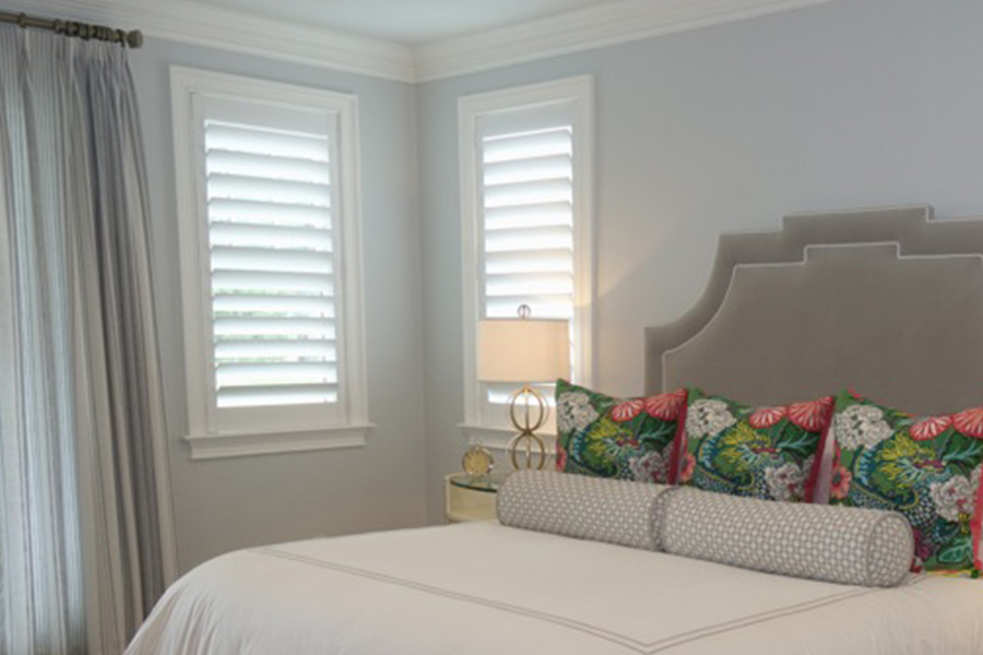 For a minimalist look, rear tilt rod shutters are a great option. Rear tilt rod windows within a bedroom.
