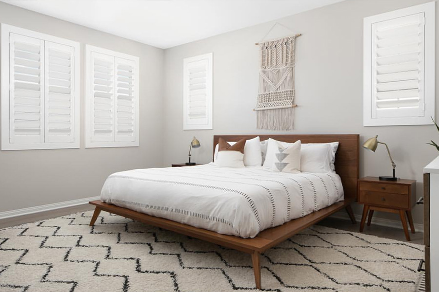 White polywood shutters in a bedroom