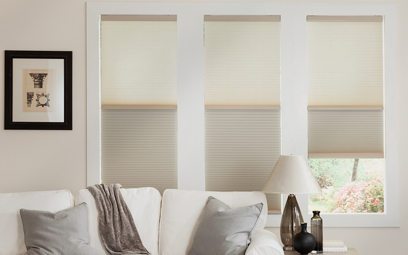 White cellular shades in a living room.