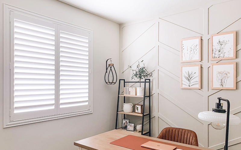 White Polywood shutters inside an office