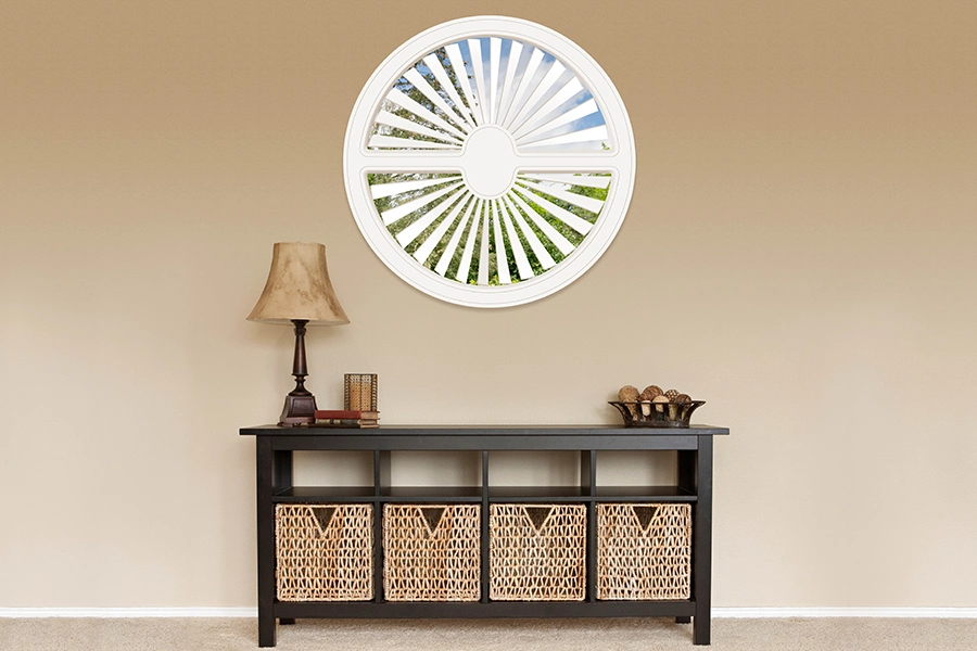 White Polywood shutter on a circle window