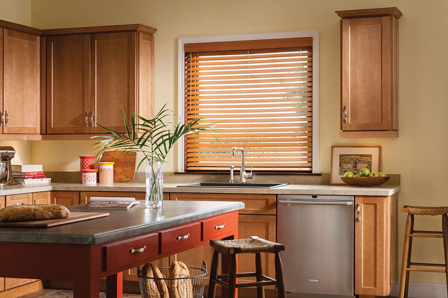 modern faux wood blinds above a kitchen sink