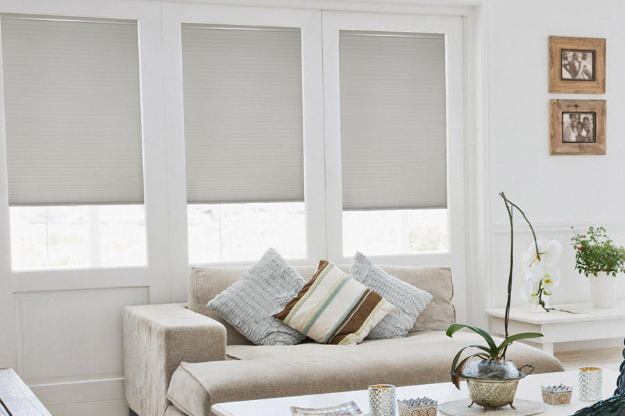 Cellular shades in a light and airy living room.