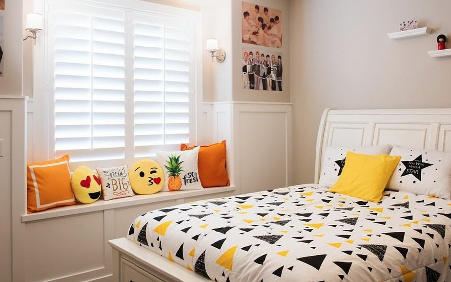 White polywood shutters in a kid's bedroom.