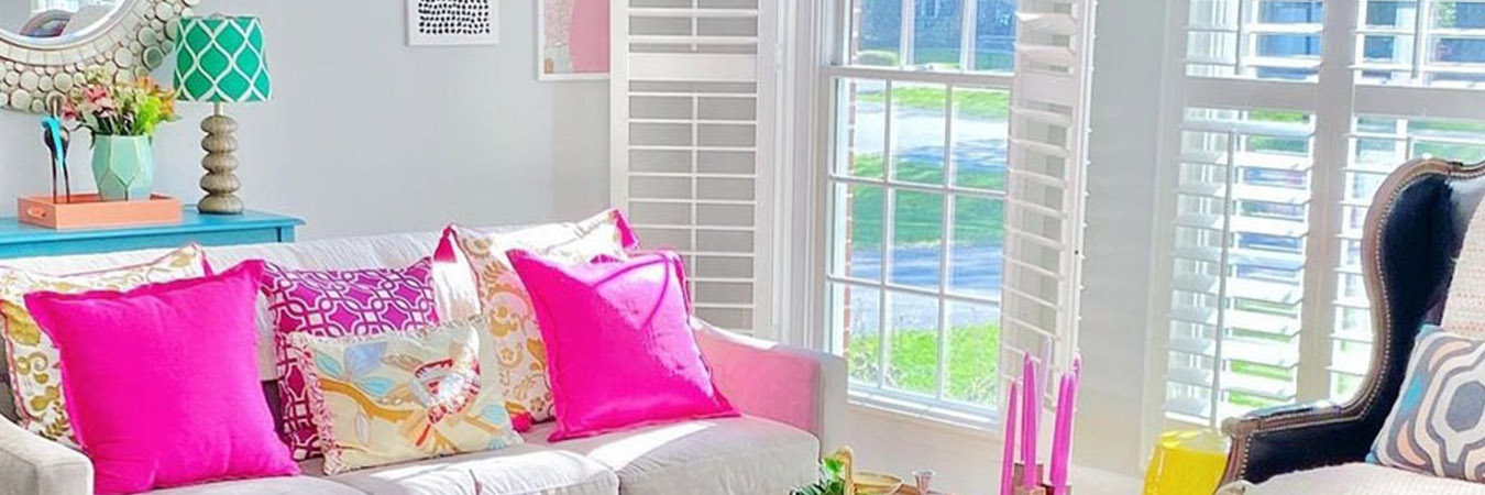 White Polywood shutters in a trendy and colorful living room