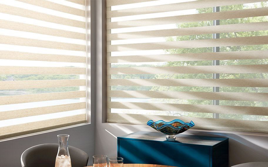 Beige zebra shades in a breakfast nook corner