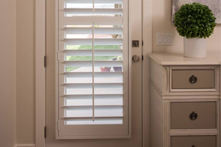 White Polywood shutters on a door 