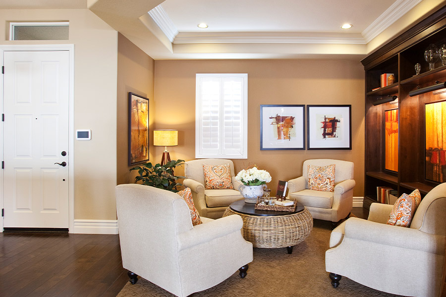 Neutral colors of brown and beige in a den area.