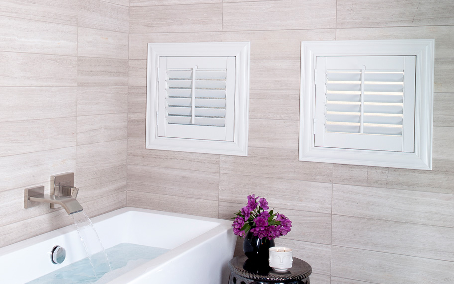 White square shutters in a bathroom.