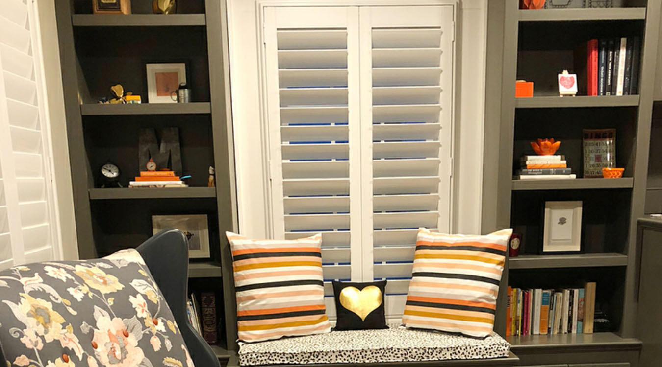 Reading nook with white louvered shutters