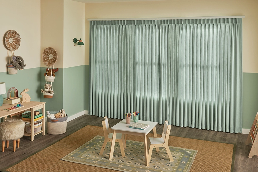If you take care of them, good drapes can beautify your home for a decade or more! Green draperies on a playroom window