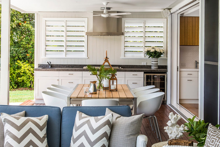 Comfortable outdoor seating area with Polywood shutters