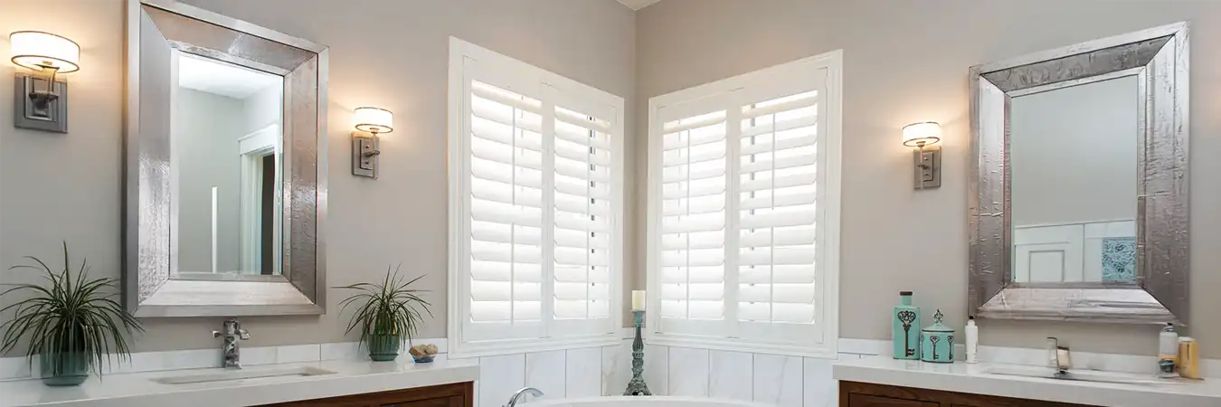 White Polywood shutters on bathroom windows