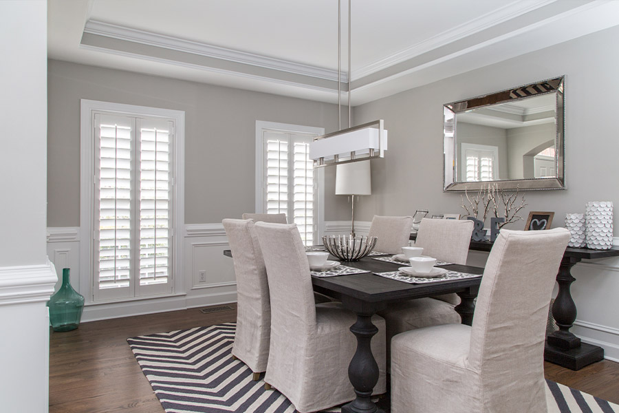 Spacious dining room with two large Polywood shutter windows.
