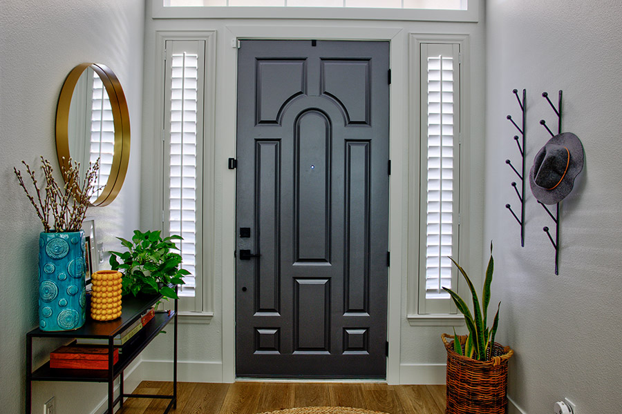 Polywood shutters on entryway sidelight windows