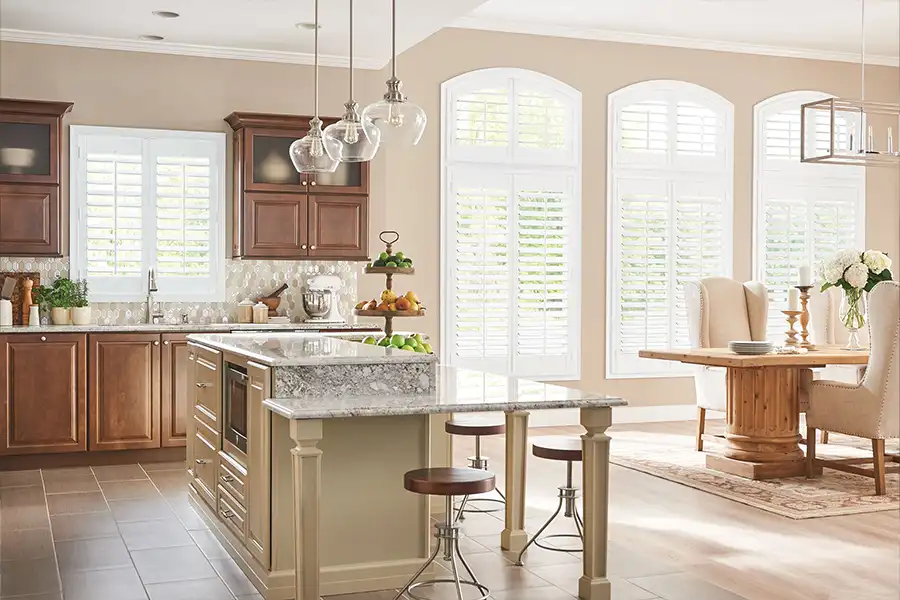 White Polywood shutters on large and small kitchen windows