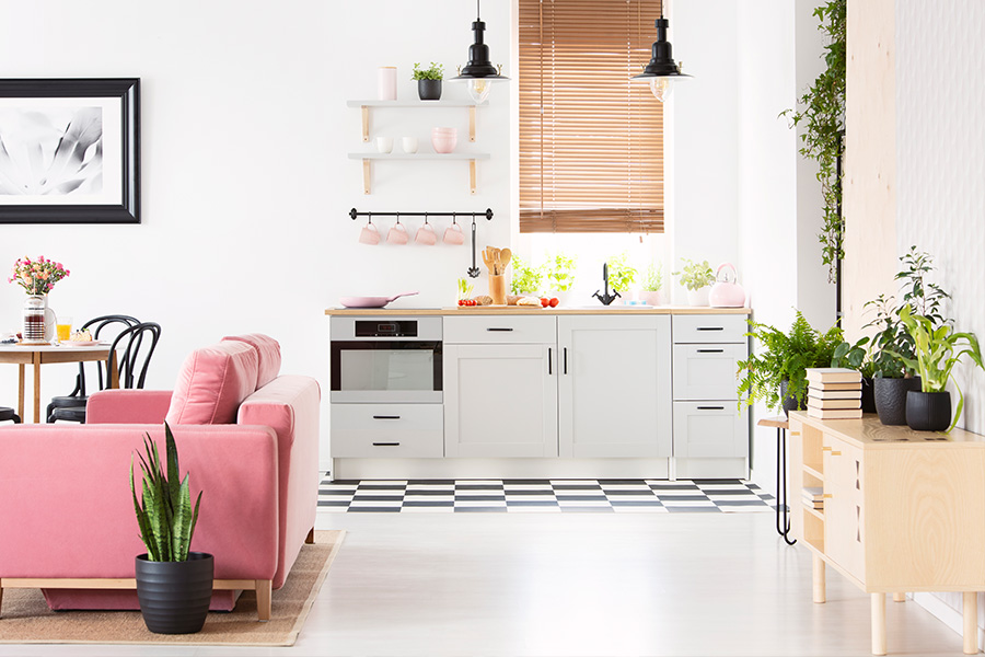Put moisture-resistant Polywood blinds on a kitchen sink window with no worries! Tan Polywood blinds over a modern kitchenette sink.