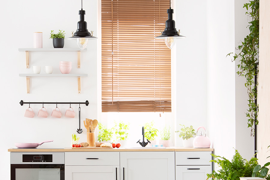 wood blinds above a kitchen sink