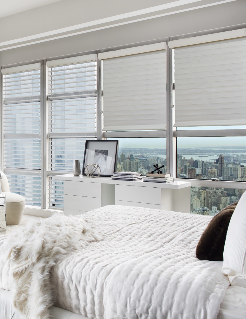 Sheer shades in a bedroom overlooking Manhattan