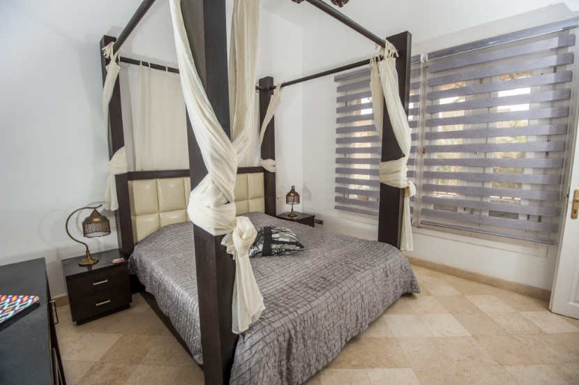 Transitional shades in a bedroom