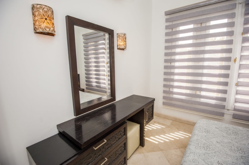 Transitional zebra shades in a bedroom