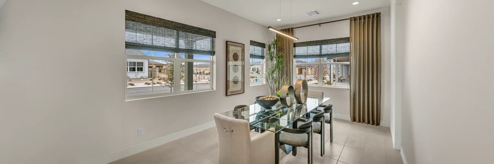 sage green woven shades in a large beige dining room