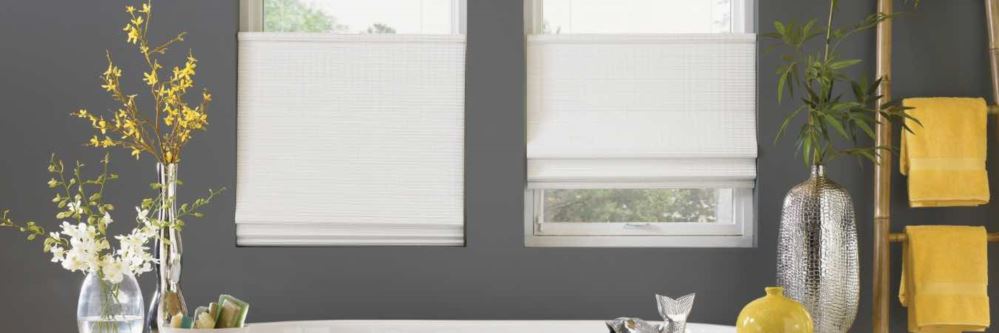 White window shades in a gray and yellow bathroom