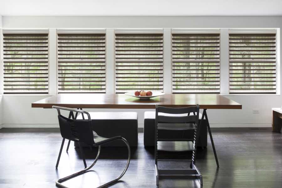 The Sunburst team is here to answer all your questions about window treatments and installation. Brown blinds on dining room windows