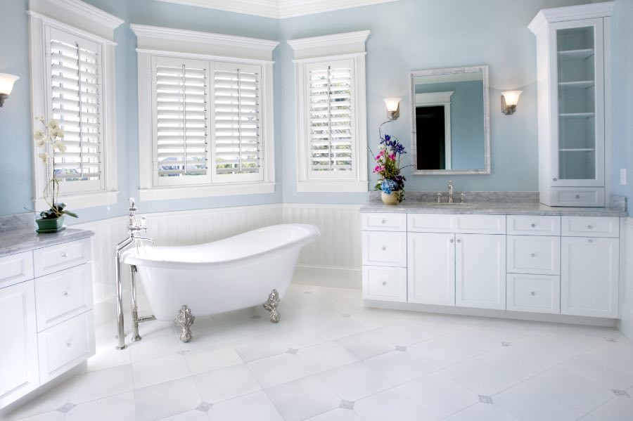Add character to your modern bathroom with features like this free-standing tub. Bright, neutral-colored bathroom with free-standing tub.