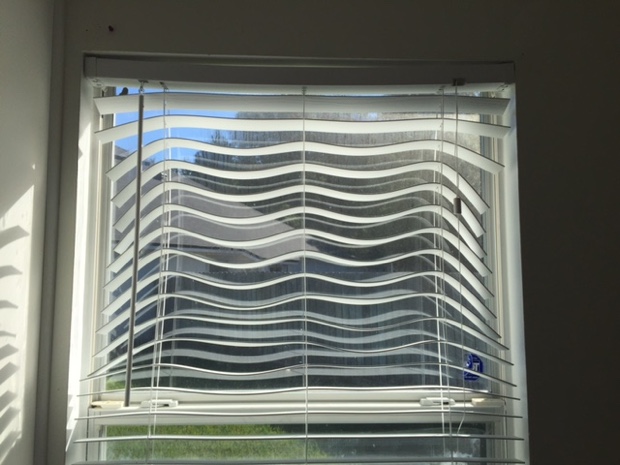 A competitor’s blind easily warps in the hot sun. Photo Credit: Adam Nourse Warped blinds in a window