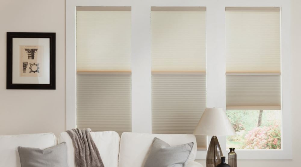 Cellular shades are energy-efficient and block air from coming through the glass. Cellular shades over a couch