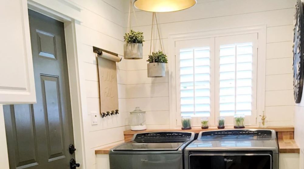 Laundry room with plantation shutters