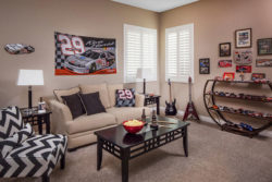 Photo Credit: Room Resolutions Interior Design. Plantation shutters in a man cave